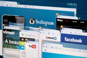 Social network homepage on a monitor screen.